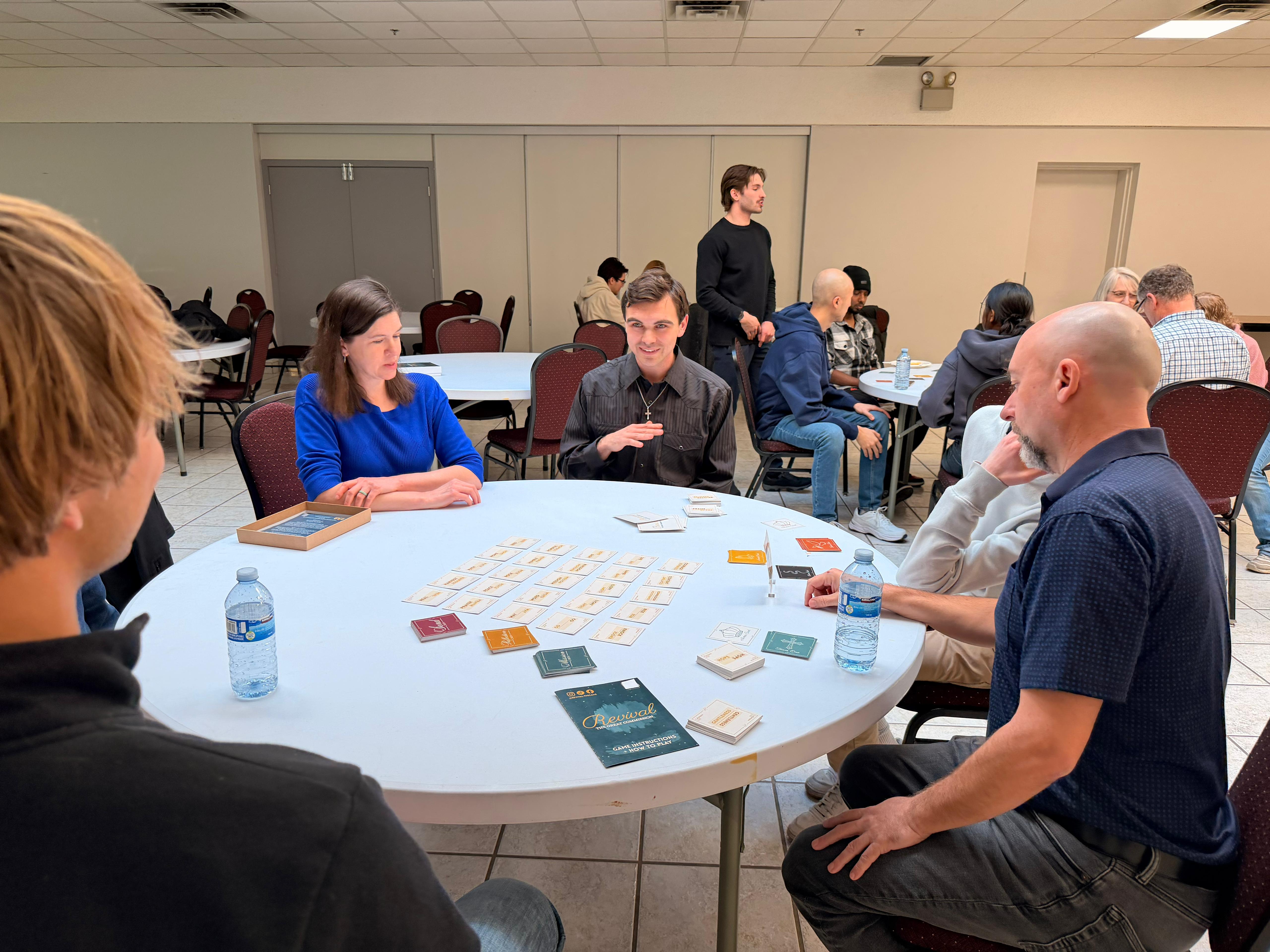 Church event — Revival cards spread on round table